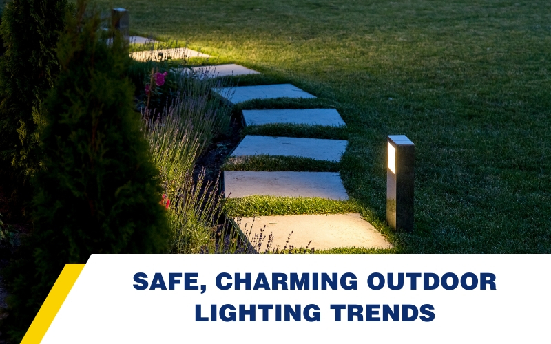 An outdoor pathway illuminated by modern-looking outdoor lighting.