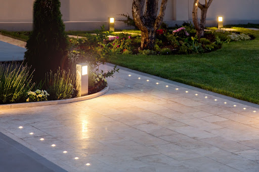 Landscape lighting installed at the front of a house.