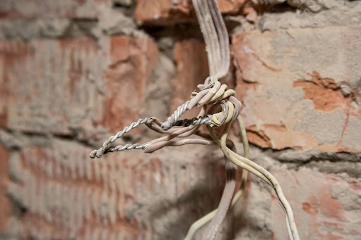 Old electrical wiring hastily spliced together.